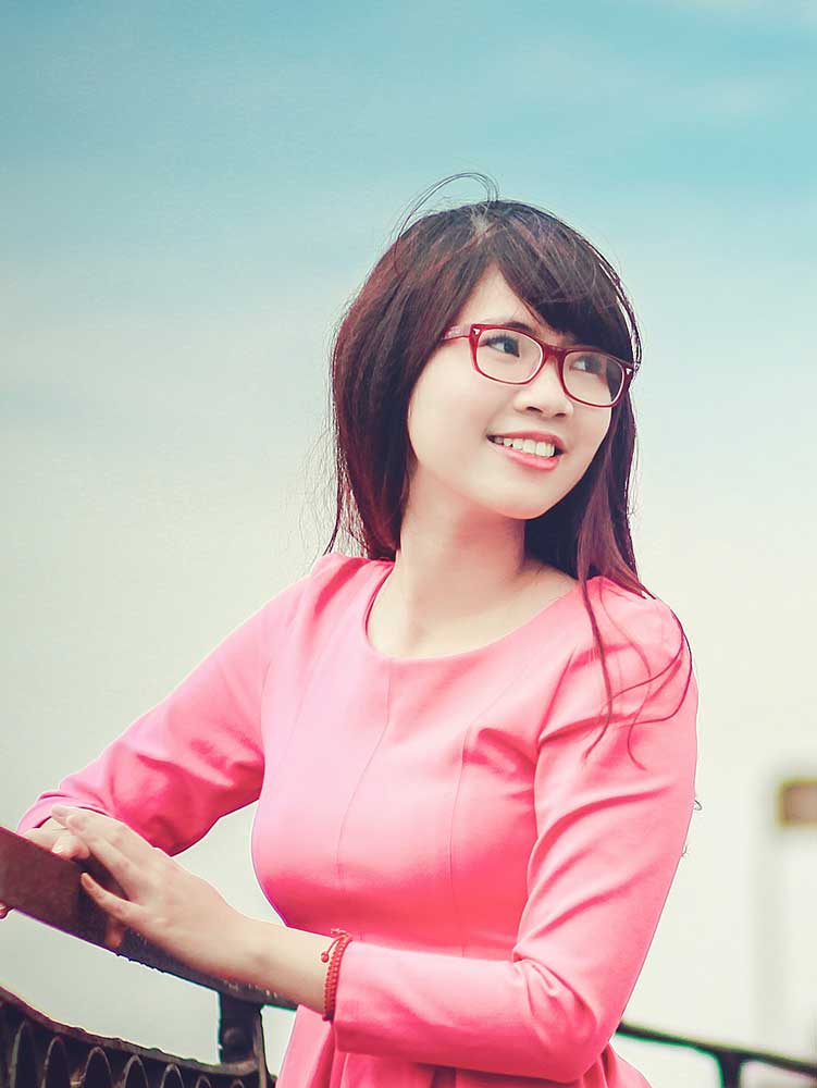 Woman In Pink Shirt Smiling